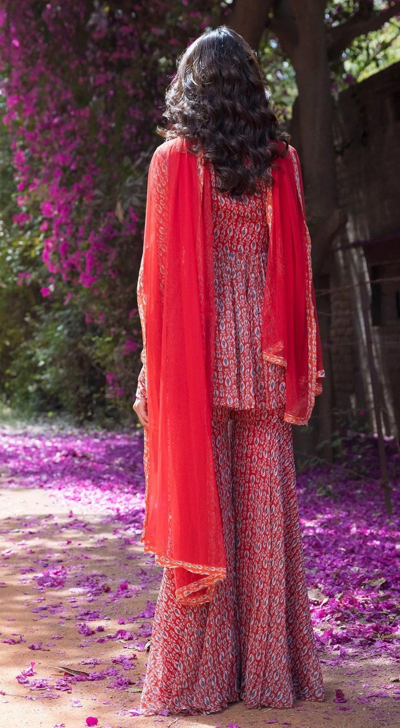 Drop Printed Full Sleeves Sharara Suit Set with A Peplum Top Front Embellishment - RED - Basanti Kapde aur Koffee